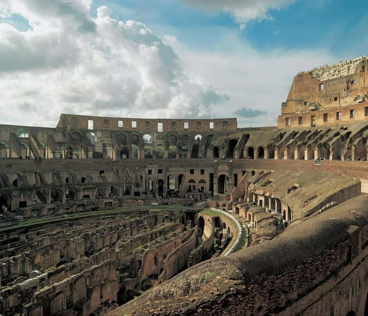 Rome: Morning Colosseum, Roman Forum & Palatine Hill Tour - Walking Through the Roman Forum